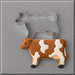 A brown and white cow cookie in front of a 4 inch Cow Metal Cookie Cutter