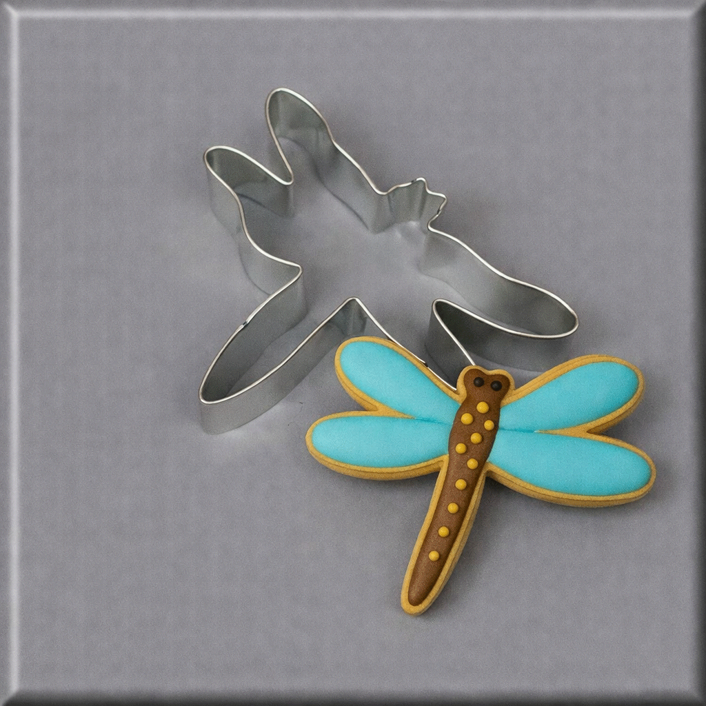 A blue and brown dragonfly cookie and a 3.5 inch Dragonfly Metal Cookie Cutter