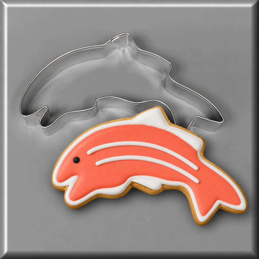A salmon decorated cookie and a 5 inch Salmon Fish Metal Cookie Cutter