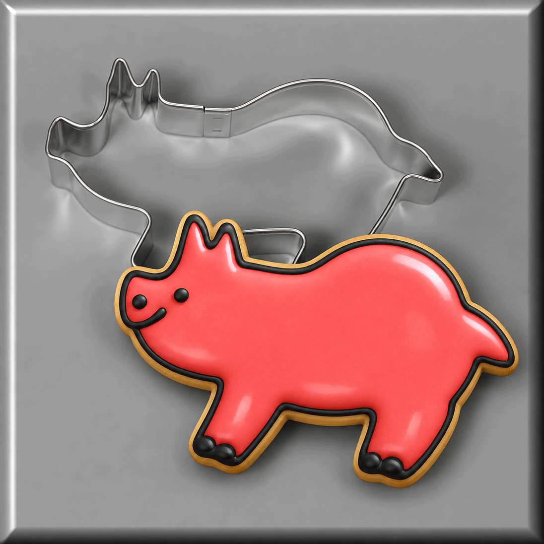 A pink smiling pig cookie with a 3.75 inch Pig Metal Cookie Cutter