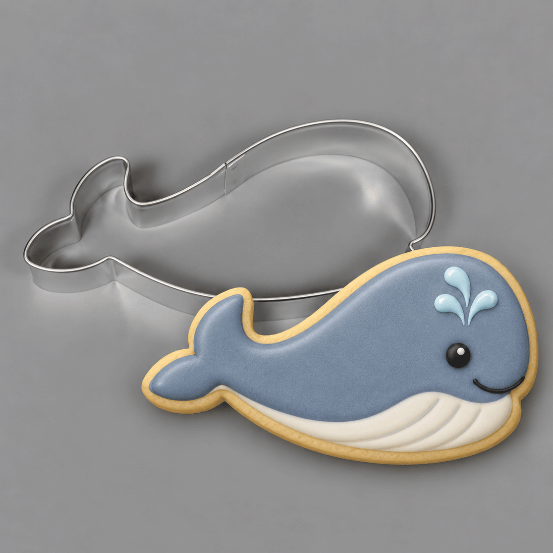 A gray and white whale cookie and a 4 inch Whale Metal Cookie Cutter