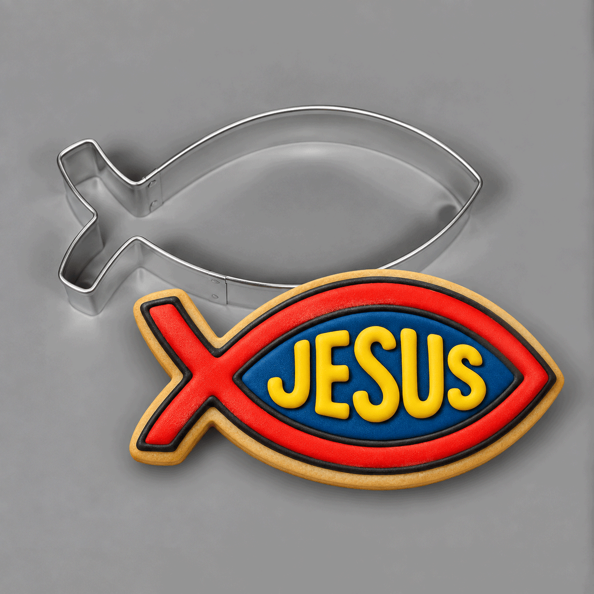 A fish decorated cookie with JESUS written on it and a 4.5 inch Jesus Fish Christian Symbol Metal Cookie Cutter