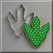 A green scaled dino foot cookie and a 4 inch Dinosaur Foot Print Metal Cookie Cutter