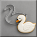 White swan cookie next to a 4 inch Swan Metal Cookie Cutter