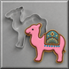 A pink camel cookie shown next to a 4 inch Camel Metal Cookie Cutter