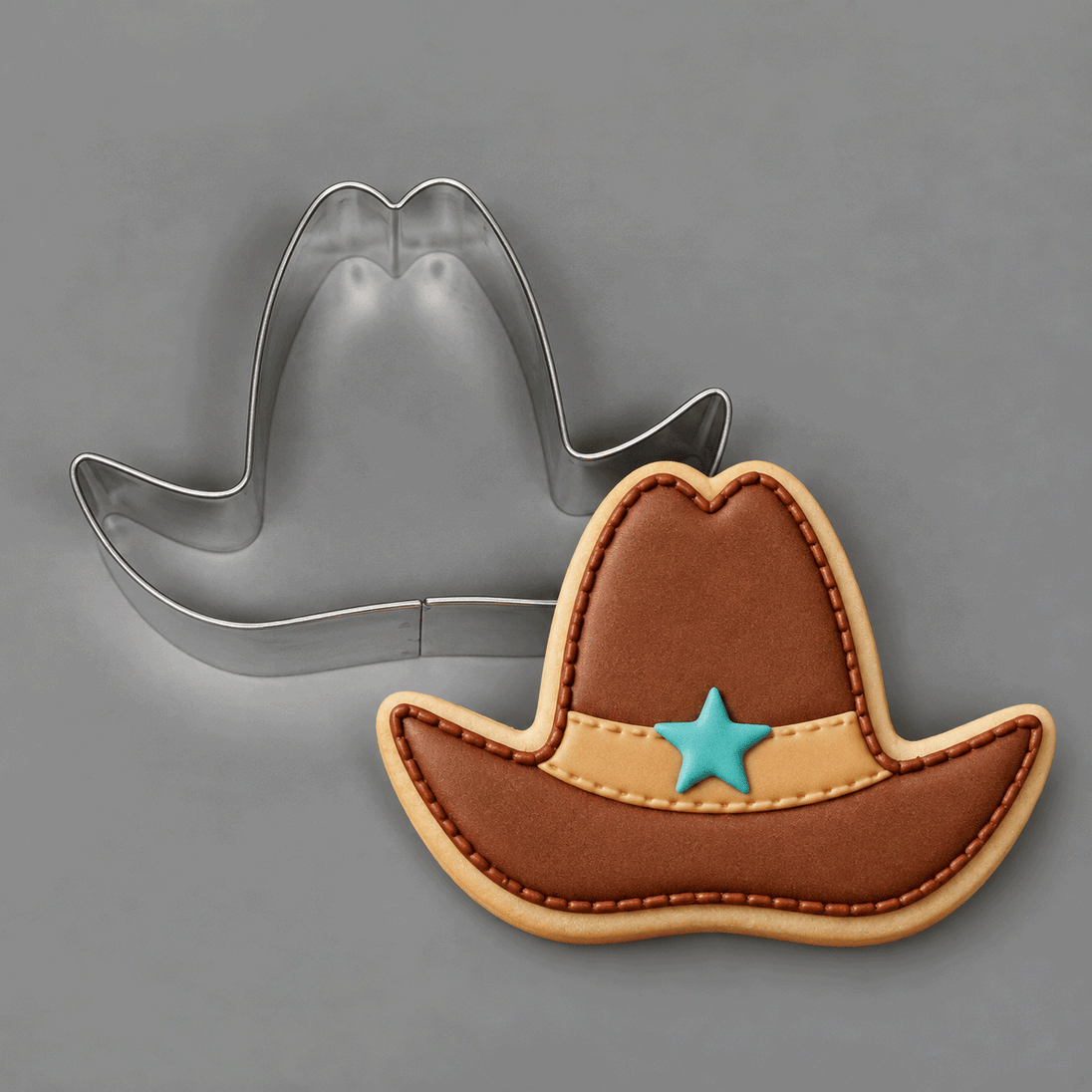 Cookie decorated as brown cowboy had with star and a 4 inch Cowboy Hat Metal Cookie Cutter