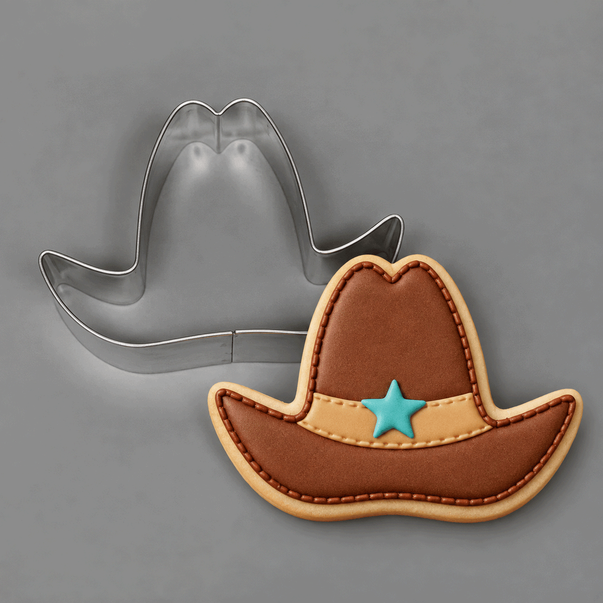 Cookie decorated as brown cowboy had with star and a 4 inch Cowboy Hat Metal Cookie Cutter