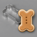 Dog bone cookie next to a 2 inch Mini Dog Bone Metal Cookie Cutter