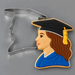 Cookie decorated as a grad girl next to a 3.75 inch Graduation Girl Metal Cookie Cutter