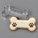 Dog bone cookie decorated with paws and a 4.5 inch Dog Bone Metal Cookie Cutter