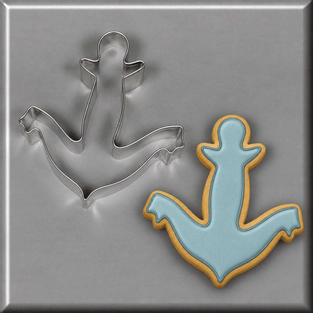 Blue anchor cookie next to a 4.5 inch Anchor Metal Cookie Cutter