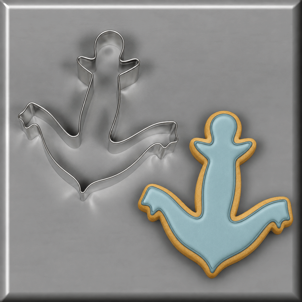 Blue anchor cookie next to a 4.5 inch Anchor Metal Cookie Cutter