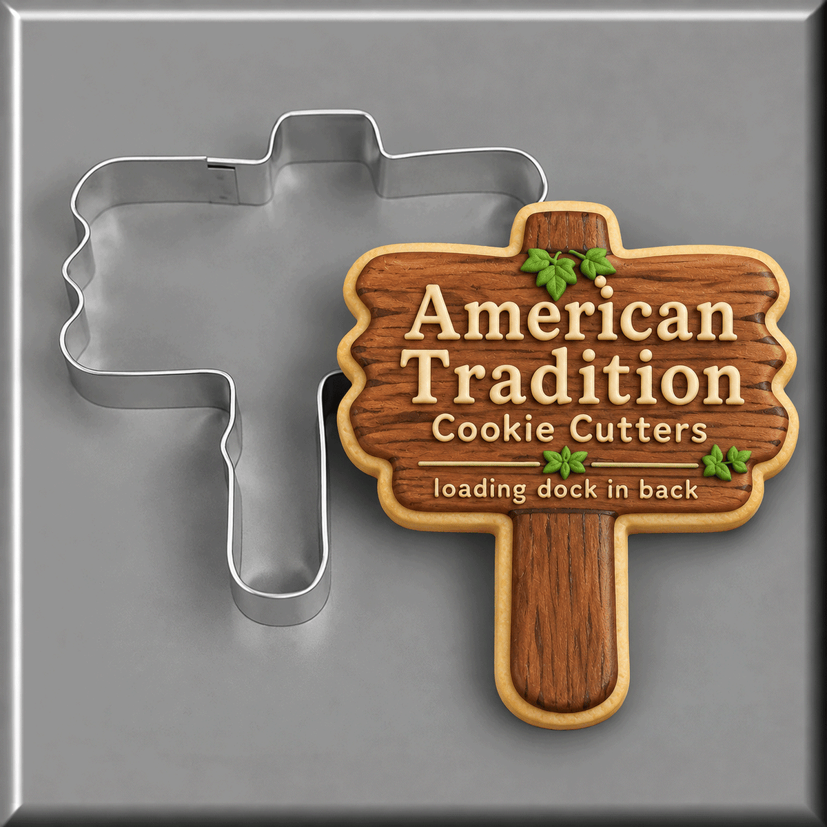 Wooden sign cookie with American Tradition Cookie Cutters written on it next to a 4.25 inch Wooden Sign Metal Cookie Cutter