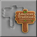 Wooden sign cookie with American Tradition Cookie Cutters written on it next to a 4.25 inch Wooden Sign Metal Cookie Cutter
