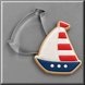 Sailboat cookie next to a 4 inch Sailboat Metal Cookie Cutter