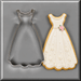 A wedding gown cookie next to a 4.75 inch Dress Metal Cookie Cutter