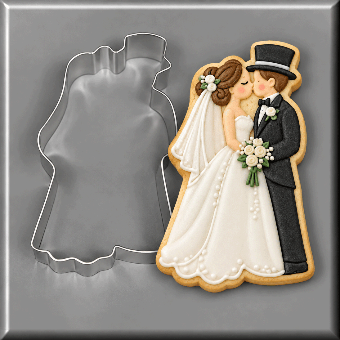 A bride and groom shaped cookie next to a 4 inch Bride and Groom Metal Cookie Cutter