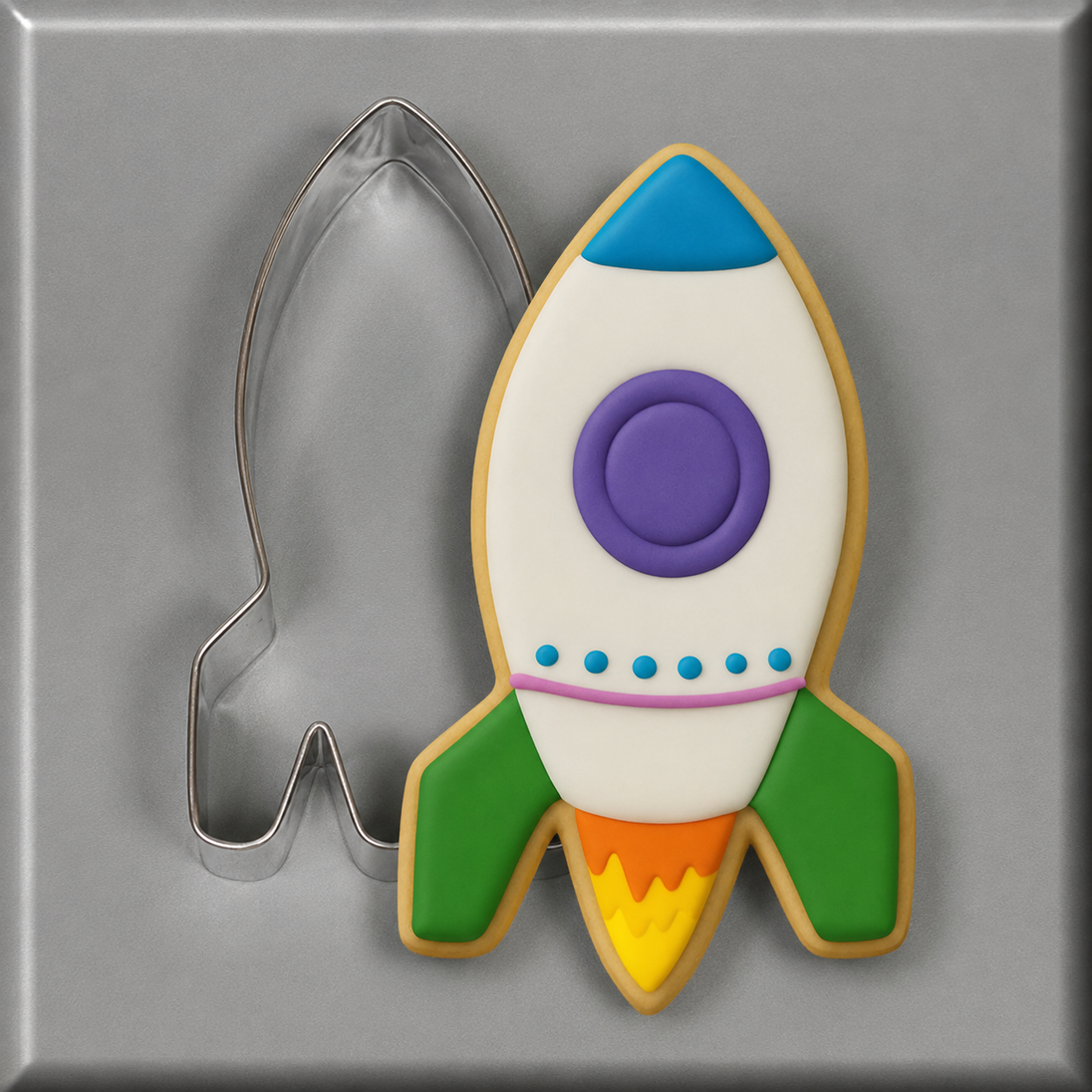 Decorated cookie and cookie cutter from a 4 inch Rocket Ship Metal Cookie Cutter
