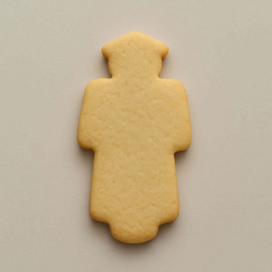 4.75 inch Graduation Graduate Metal Cookie Cutter shaped cookie on a neutral background.