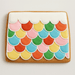 Colorful scalloped cookie on a plain background from a 6.56 inch Gingerbread House Roof Metal Cookie Cutter