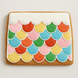 Colorful scalloped cookie on a plain background from a 6.56 inch Gingerbread House Roof Metal Cookie Cutter